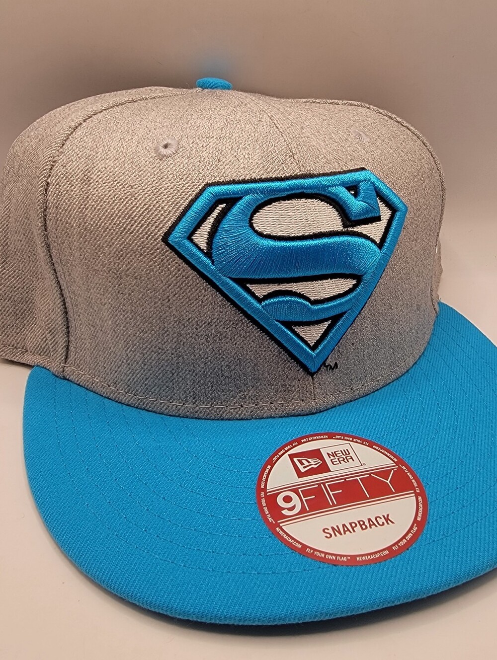 New Era Gray Snapback Hat with Bright Blue Superman Logo